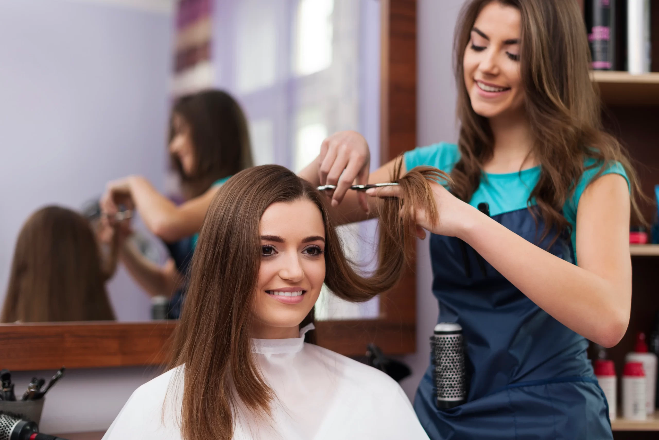 beautiful-woman-has-cutting-hair-hairdresser