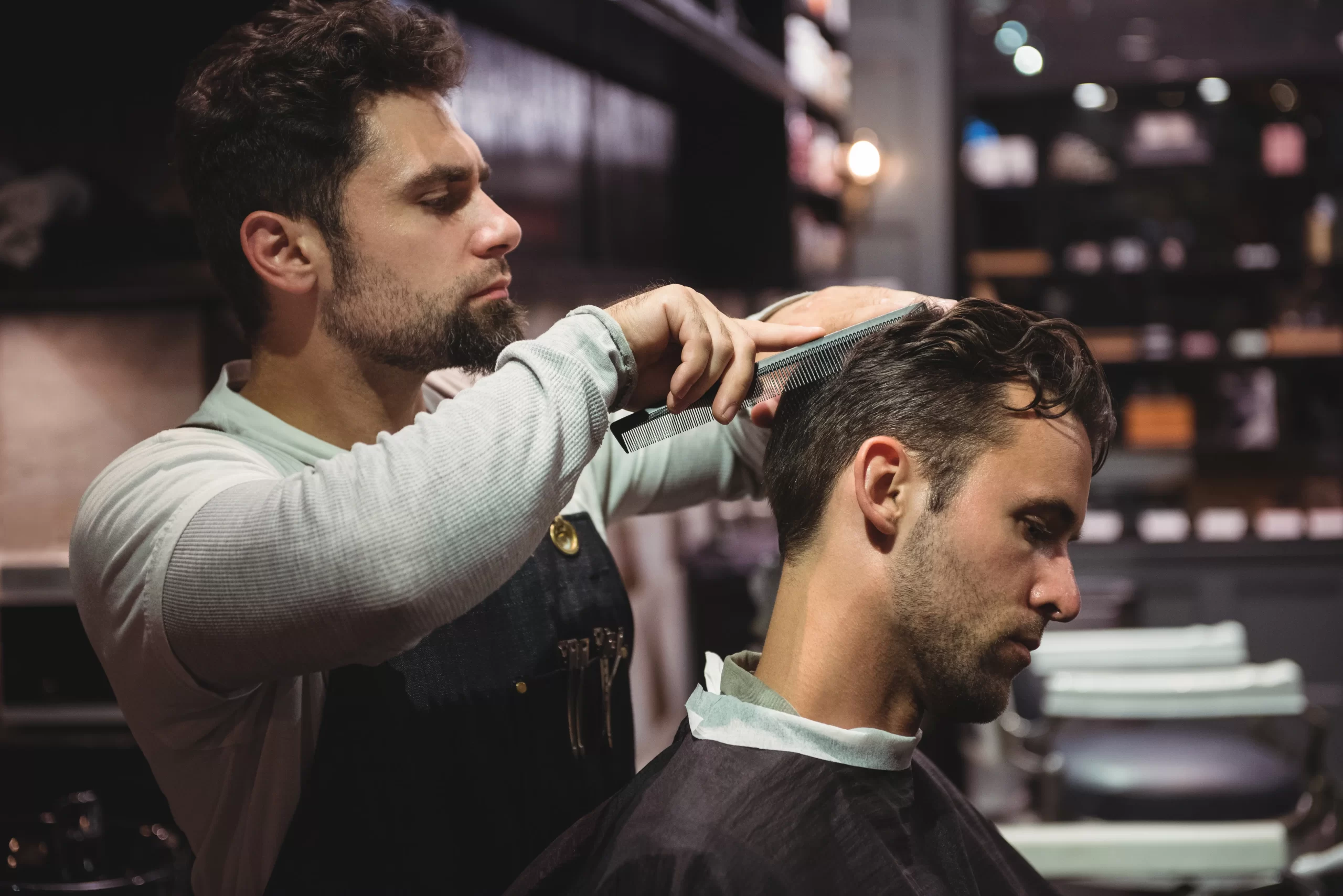 hairdresser-combing-clients-hair