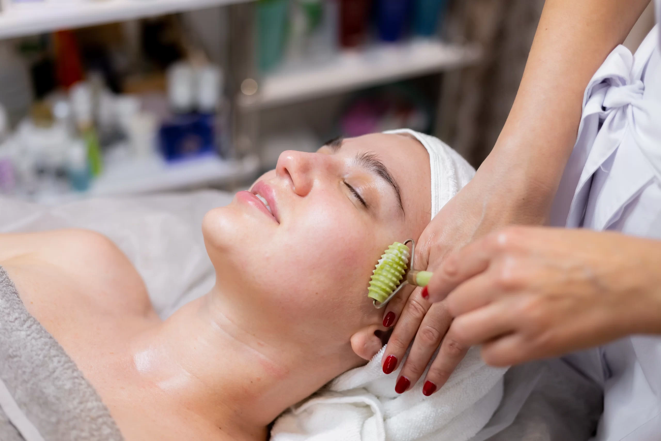 young-beautiful-girl-lies-beautician-s-table-receives-procedures-light-facial-massage